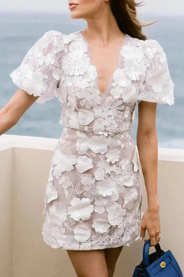 Summer-ready floral mini dress for women, with charming puff sleeves, V-neck, and 3D floral details for events.