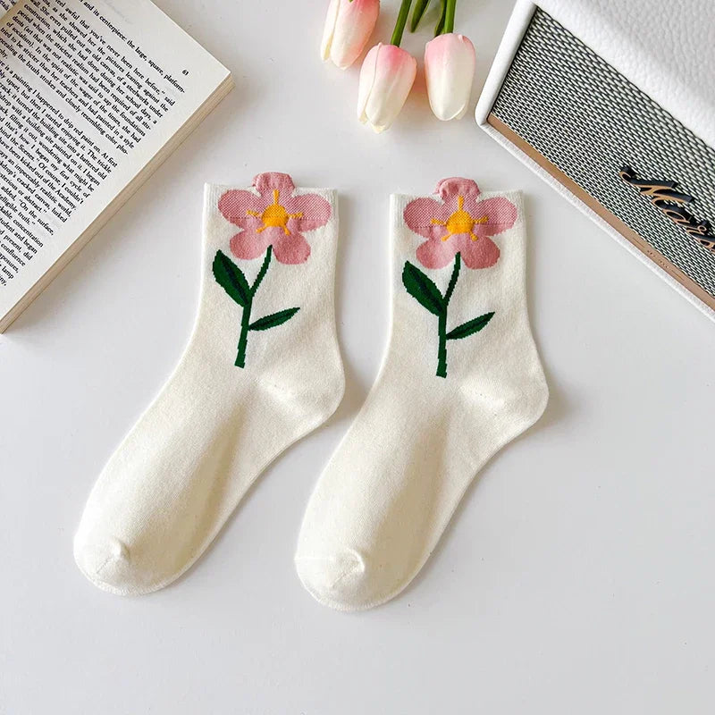 Texture shot of soft cotton blend women's socks. Floral print everyday casual socks, comfortable mid-calf length.
