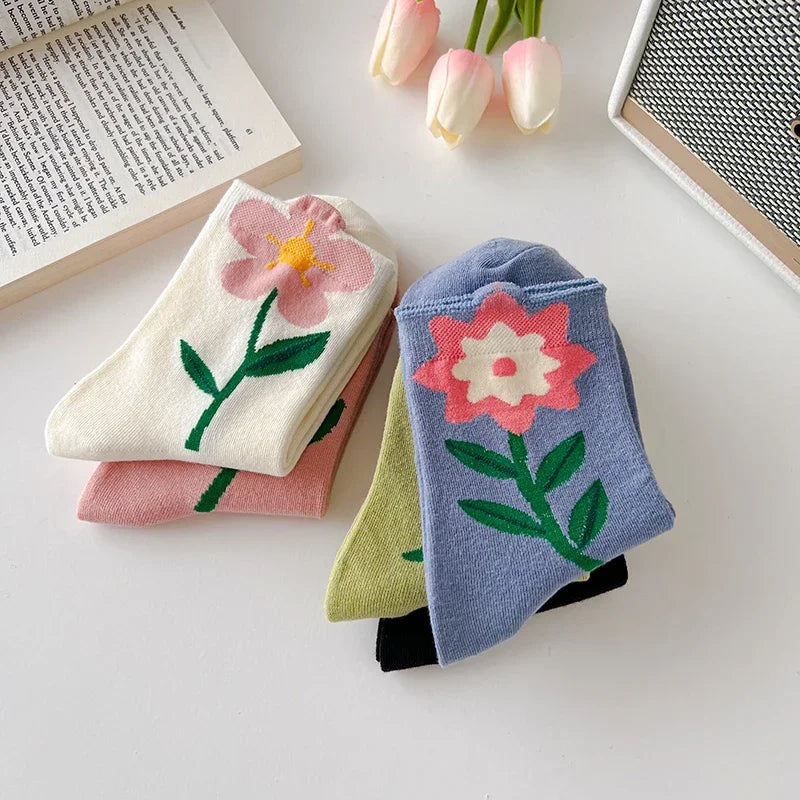 Stylish women's patterned floral socks worn casually. Cozy cotton blend mid-calf socks for everyday comfort.
