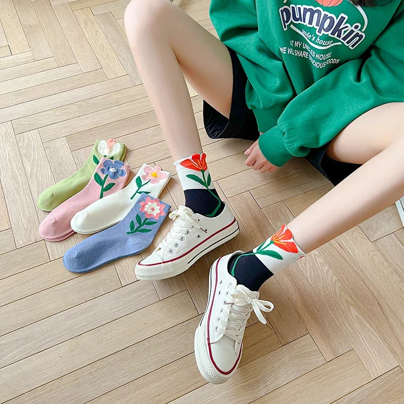 Assortment of women's floral patterned mid-calf socks. Soft cotton blend casual socks for daily comfort.