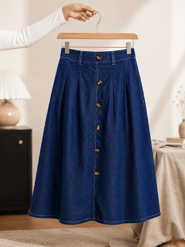 Chic women's blue denim midi skirt, A-line cut, button front, & pleats. Ideal for spring/summer fashion.