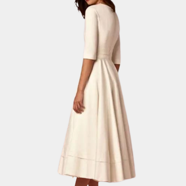 Close-up of the flattering silhouette of this women's A-line midi dress, featuring a chic side slit.