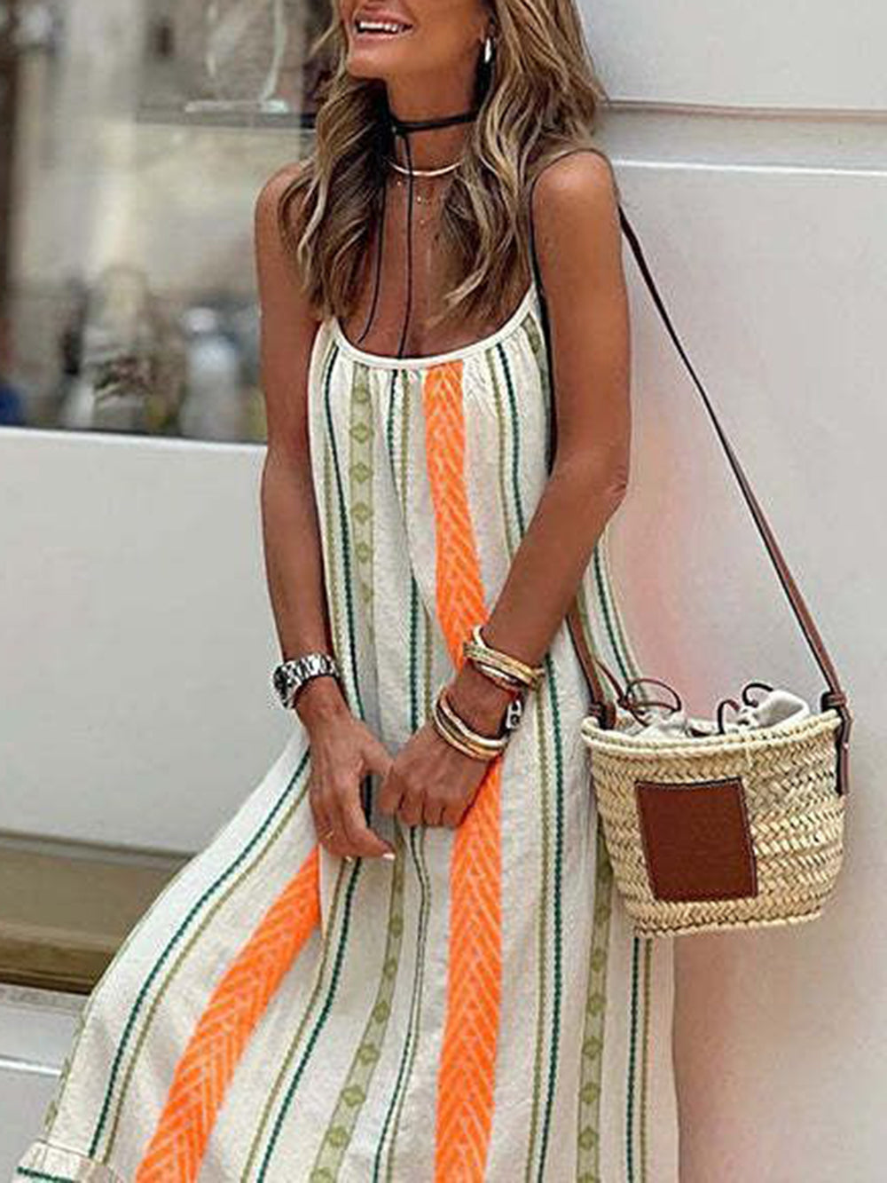 Orange striped A-line midi sundress for women, featuring spaghetti straps. Ideal for summer casual and vacation.