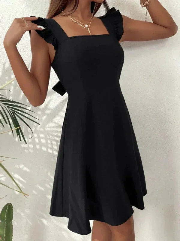 Stylish women's summer A-line short dress with lovely ruffle straps and a delicate bow back.