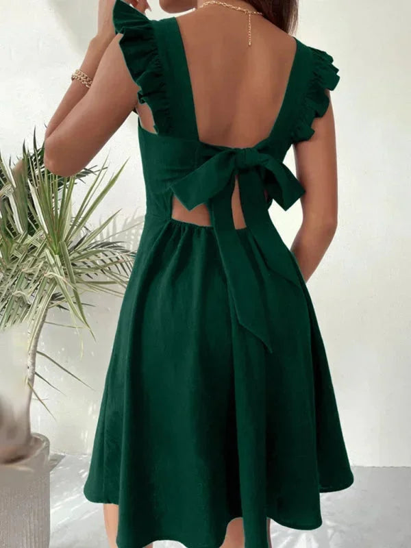 Elegant women's short dress: A-line silhouette, delicate ruffle straps, and charming bow back.