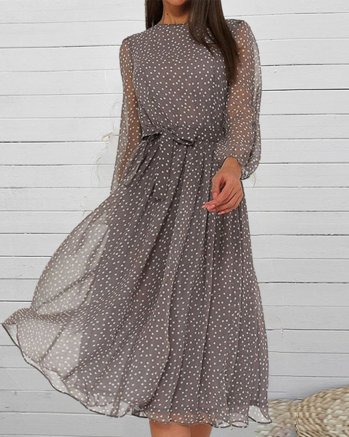 Loose-fit women's knee-length A-line polka dot dress with round neck & chic lantern sleeves, perfect for everyday wear.