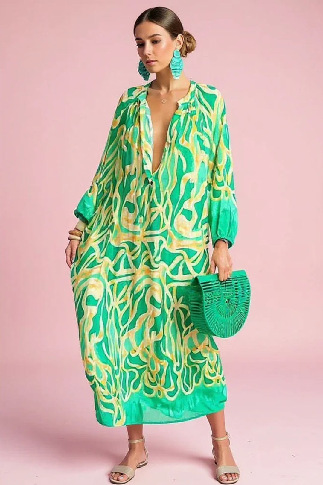 Women's abstract print V-neck kaftan maxi dress for resort wear. Flowy summer fashion, a stylish beach dress.
