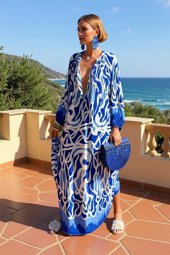 Comfortable flowy women's abstract print V-neck kaftan maxi dress. Versatile casual summer apparel or beach dress.