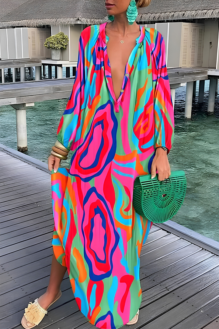 Vibrant abstract print V-neck kaftan maxi dress for women. Chic flowy summer resort wear and beach fashion apparel.