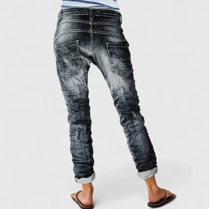 Women's acid wash skinny jeans featuring a white contrast stitch & button fly. Vintage denim look, slim fit.
