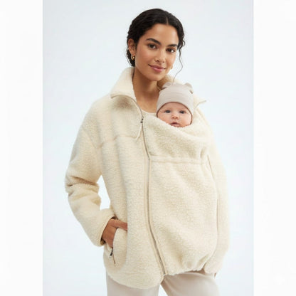 Cozy adaptive maternity & baby carrier jacket for women, providing warmth and comfort through all stages.