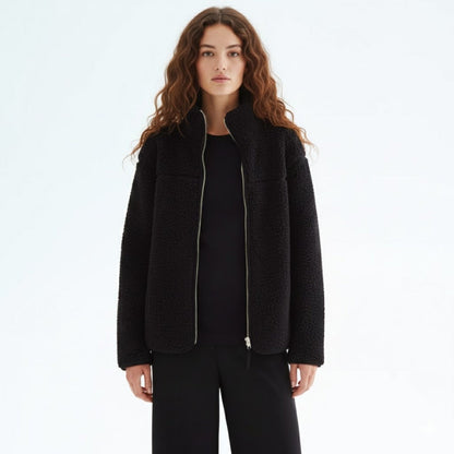 Comfortable fall/winter adaptive jacket for women, designed for maternity, baby carrier, & versatile use.