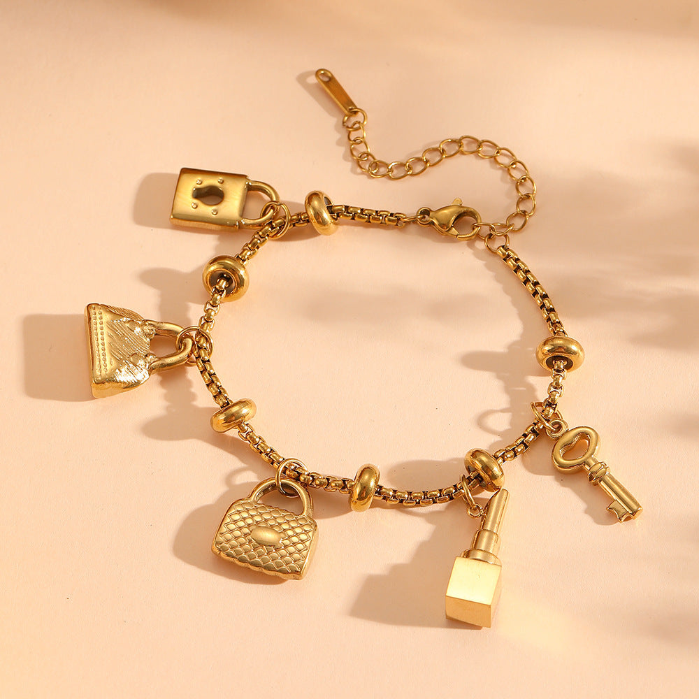 Gold adjustable charm bracelet for women, featuring unique, stylish charms. Elegant jewelry gift accessory.