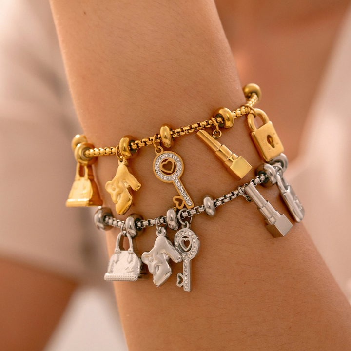 Women's adjustable charm bracelet styled on a wrist, a fashionable and elegant accessory. Perfect gift.