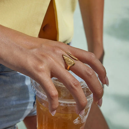 Gold-plated stainless steel adjustable ring for women, featuring detailed guardian feather wings design.