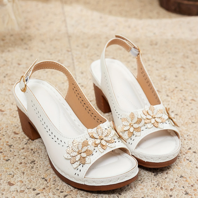 Pair of chic women's adjustable strap sandals, ready for comfortable summer daily wear.