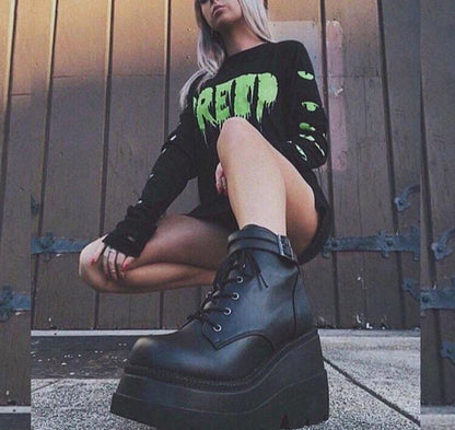 Close-up of Adora women's platform ankle boots, showcasing sturdy sole & edgy design.