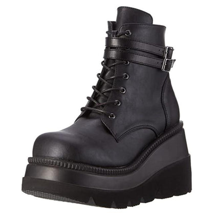 Model wearing Women's Adora platform ankle boots, highlighting edgy alternative fashion and comfort.
