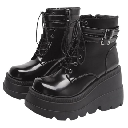 Detail of the waterproof material and sturdy platform heel on Women's Adora ankle boots. Edgy style.