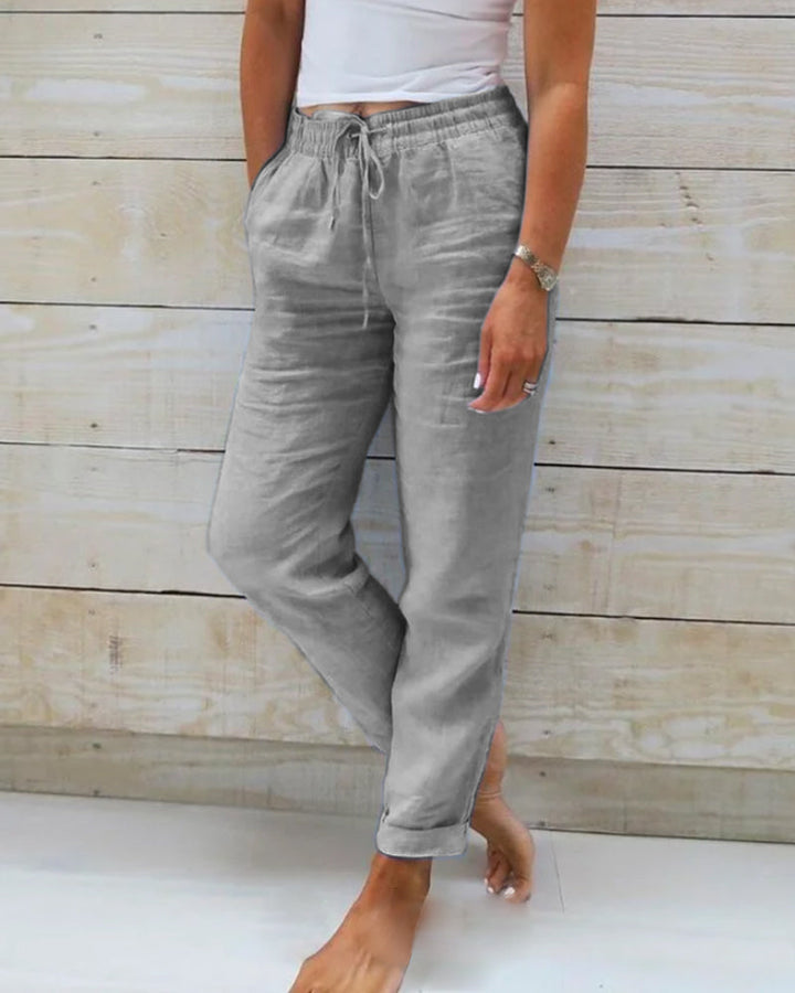 Lightweight women's casual trousers with elastic waist, offering airy comfort for warm summer days.