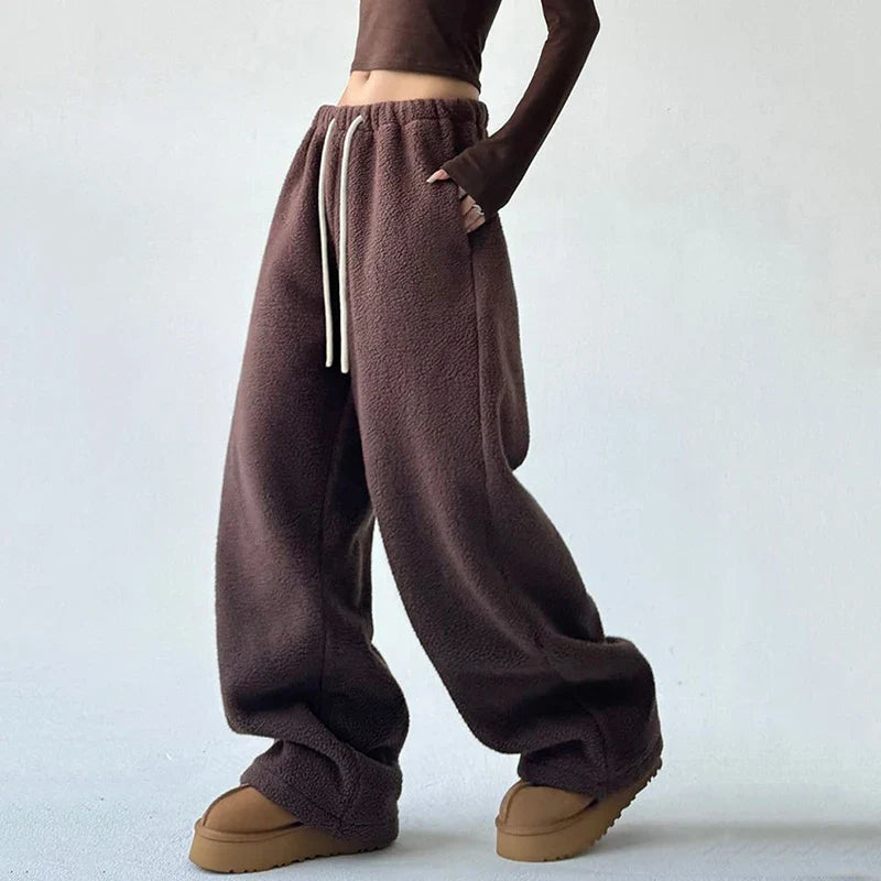 Olive green women's Alta wide leg sweatpants with drawstring for comfortable, stylish streetwear or loungewear.