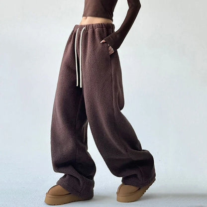 Olive green women's Alta wide leg sweatpants with drawstring for comfortable, stylish streetwear or loungewear.