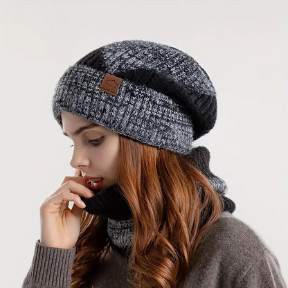 Woman wearing stylish Amara warm beanie and matching scarf set, perfect for elegant winter outfits and cold weather.
