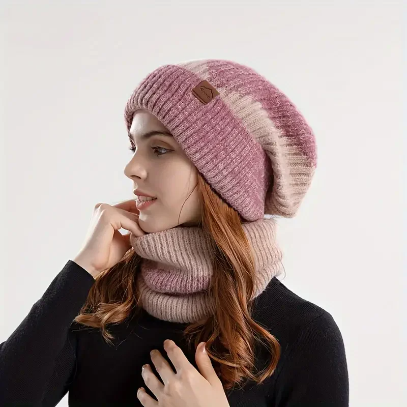 Neatly folded Amara women's warm beanie and scarf set, a cozy and stylish winter gift. Ideal cold weather accessory.