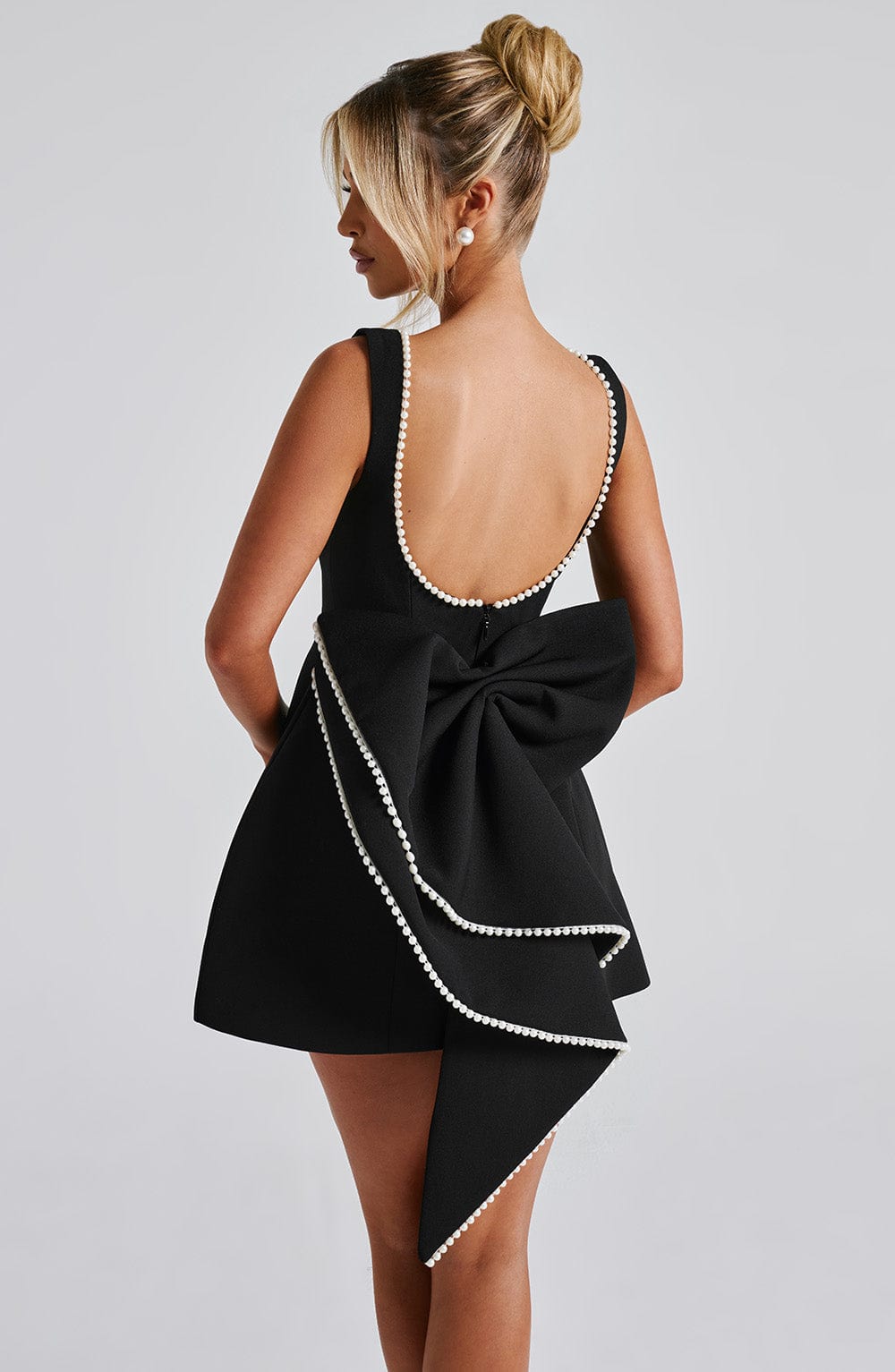 Pink Amber structured mini dress for women. Elegant sleeveless party dress, great for evening wear.