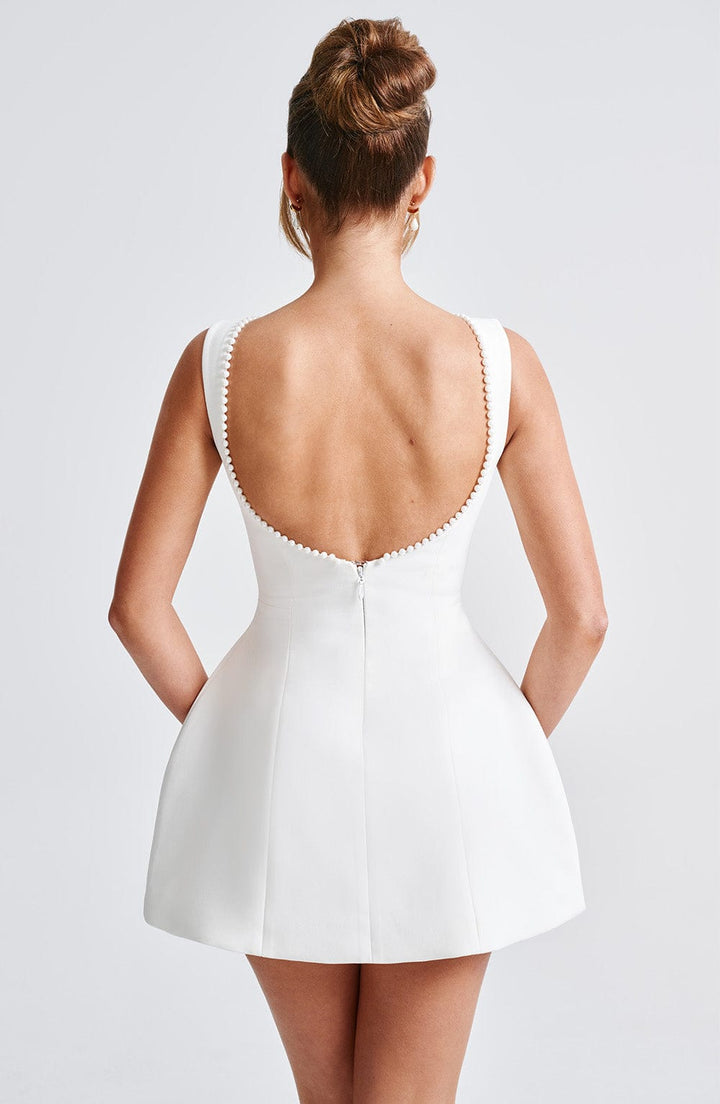 Women's structured mini dress. Elegant sleeveless tailored design for parties, evening wear & cocktails.