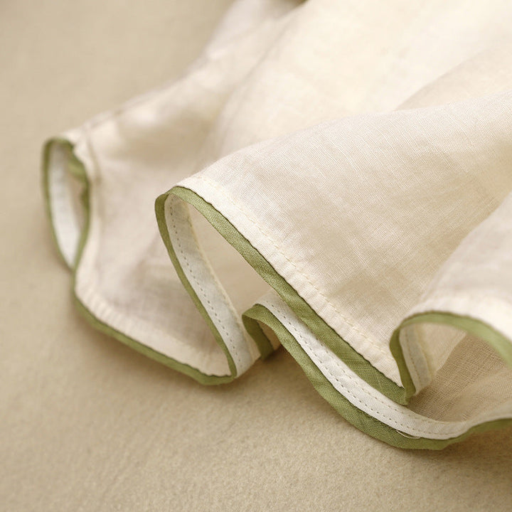 Cream ladies embroidered wrap shirt, a chic short sleeve top for comfortable and elegant summer style.