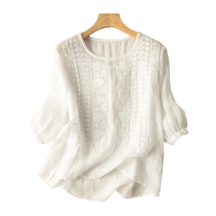 Women's Annelise embroidered floral puff sleeve blouse with three-quarter sleeves and a round neck, ideal for spring.