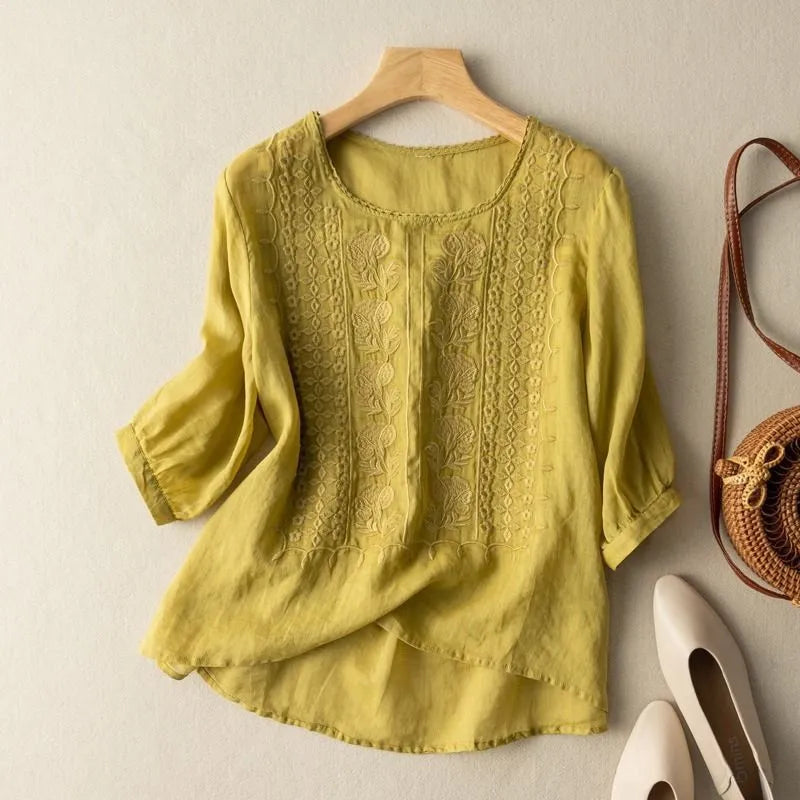 Casual chic Annelise puff sleeve blouse for women with delicate embroidery, a round neck, and a comfortable loose fit.