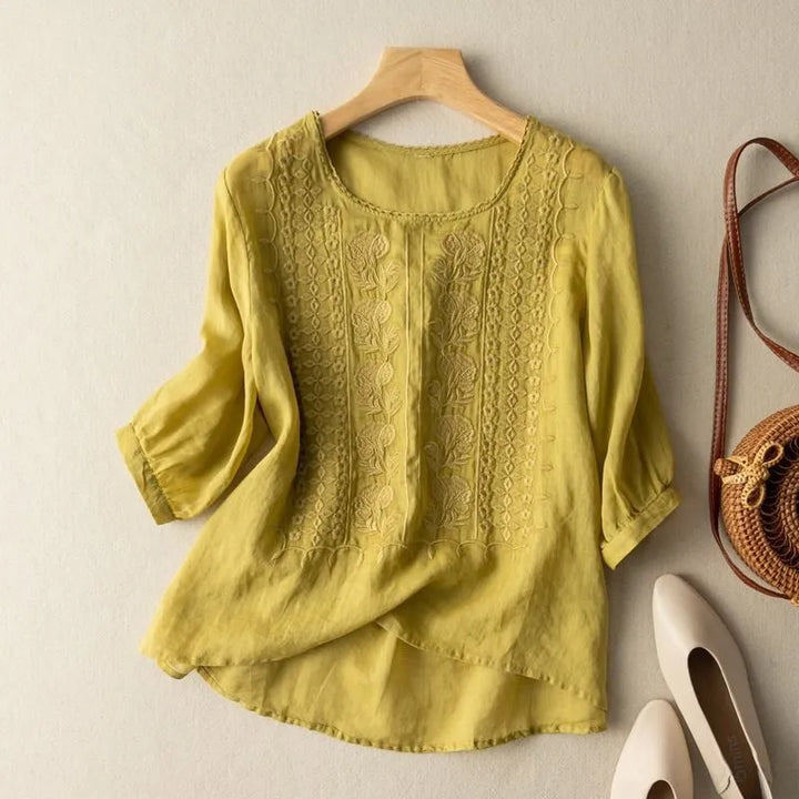 Casual chic Annelise puff sleeve blouse for women with delicate embroidery, a round neck, and a comfortable loose fit.