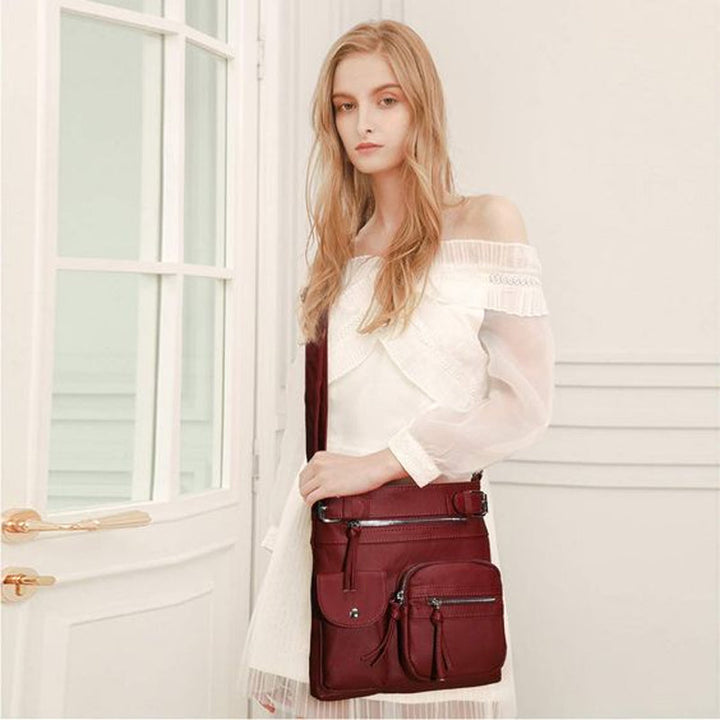 Versatile women's crossbody travel bag, featuring cut-resistant straps & RFID protection.