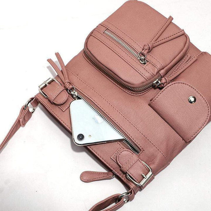 Women's secure shoulder bag, shown with anti-theft zippers and durable material.