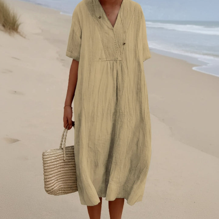 A-line women's midi summer dress in a flowing fabric, featuring a V-neck for chic, comfortable style.