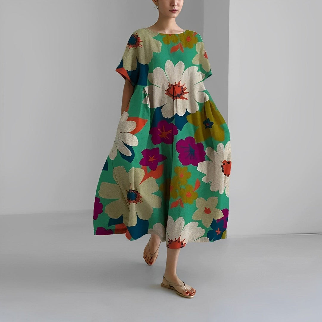 Flowy women's midi dress with artistic print. Relaxed fit, short sleeves, blending comfort & style.