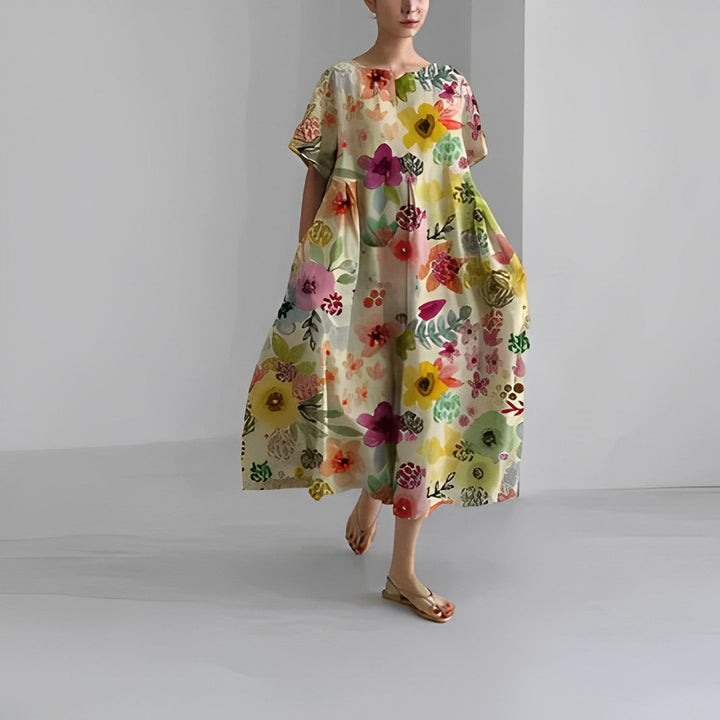 Women's casual artistic print midi dress with pockets. Relaxed flowy fit for comfortable everyday wear.