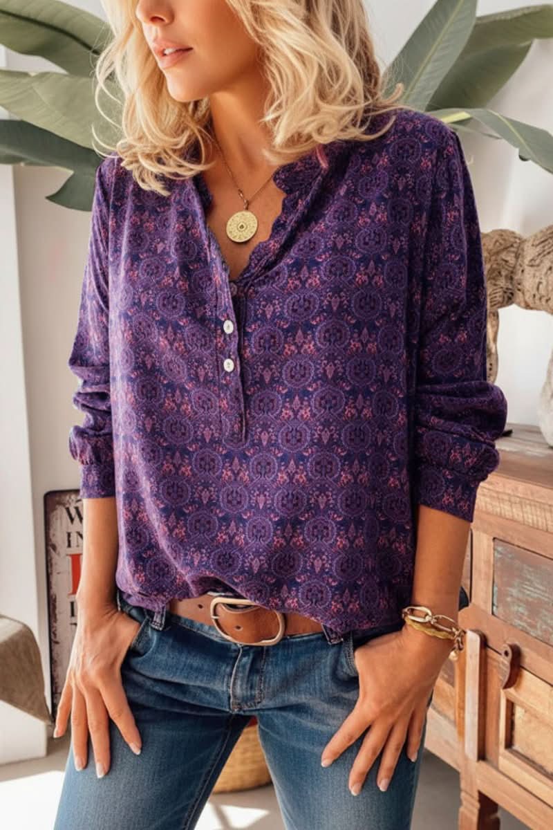 Detail of women's long sleeve blouse showcasing a unique artistic vintage pattern & button-up front.