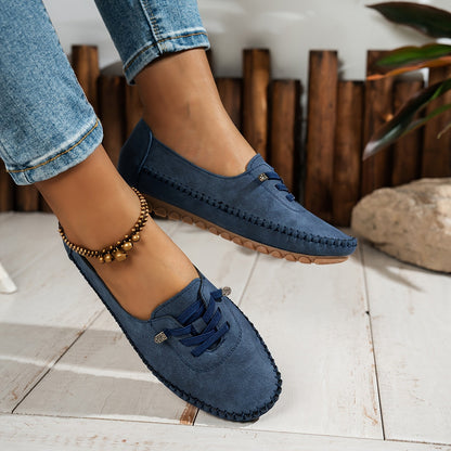 Close-up of Ashley women's slip-on shoes, highlighting material texture, arch support & comfy features.