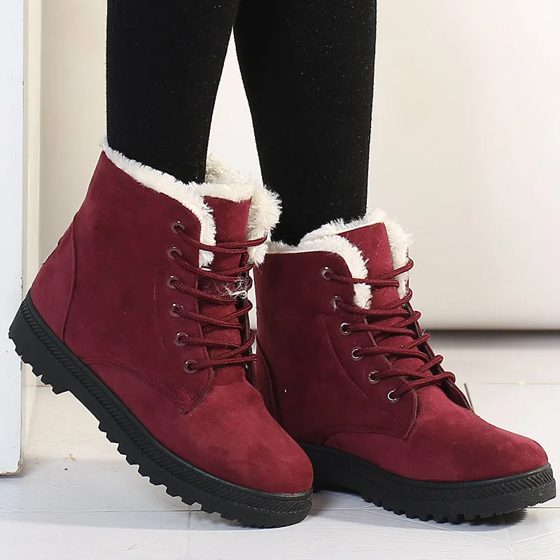 Women's Aspen Plush Winter Boots, offering cozy warmth & secure traction for cold weather. Stylish lace-up design.