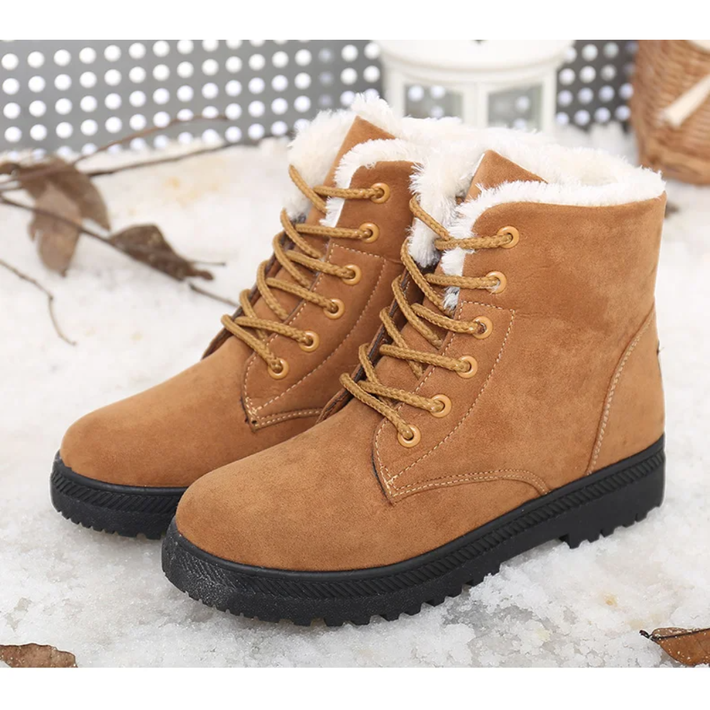 Lace-up women's snow boots. Aspen plush winter boots provide cozy warmth and secure traction for snowy adventures.