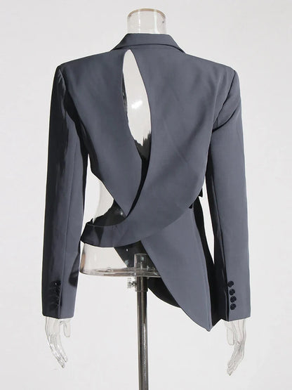 Elegant women's blazer with a bold asymmetric cutout & fashion-forward bell sleeves for modern professional attire.