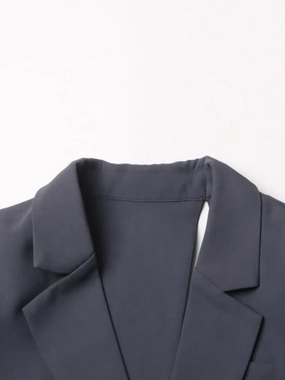 Modern women's asymmetric blazer with stylish cutout & dramatic bell sleeves. Sophisticated formal wear.