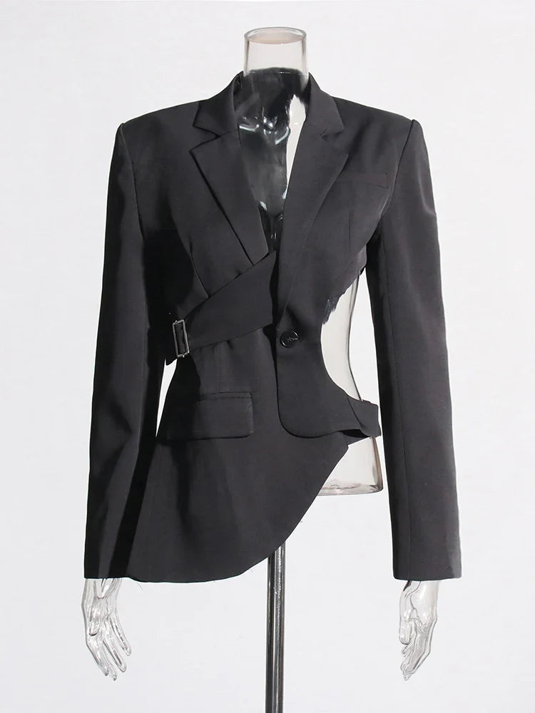 Contemporary women's blazer featuring an asymmetric hem, cutout detail, and trendy bell sleeves.