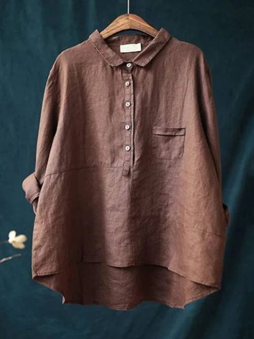 Stylish women's casual blouse with an asymmetrical hem. Versatile button-up shirt for everyday wear.