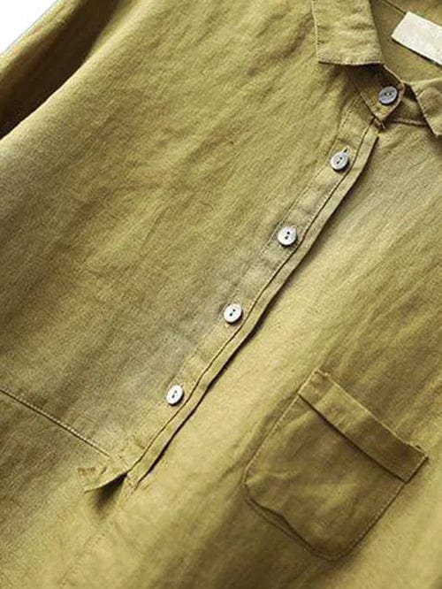 Casual women's button-up shirt with an asymmetrical hem. A versatile long sleeve blouse for relaxed everyday looks.