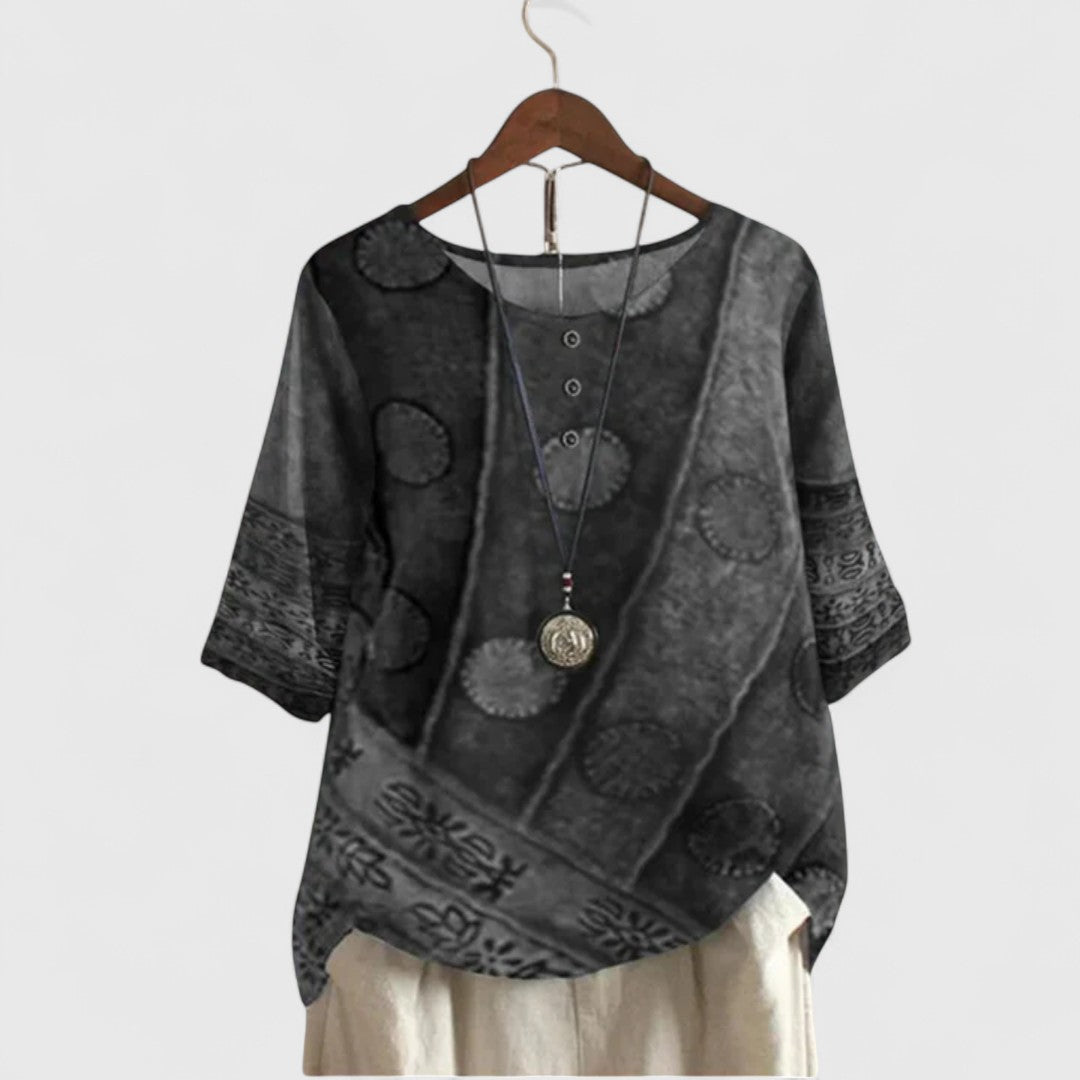 Stylish women's Auralie boho patchwork blouse, featuring unique vibrant prints & a relaxed fit for everyday comfort.