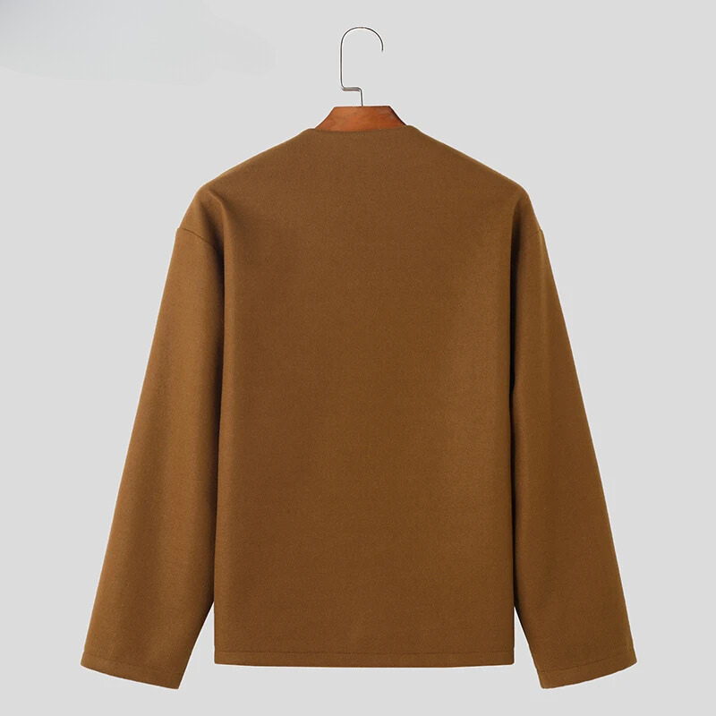 Woman wearing a versatile Avelon button-up jacket, perfect for a casual outing. Long sleeve, round neckline outerwear.